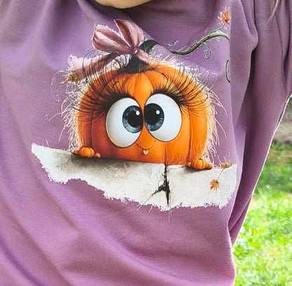 Bügelbild lustiges Kürbis Mädchen hinter Mauer