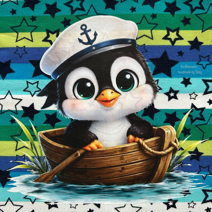 Bügelbild schwarzer Pinguin im Boot